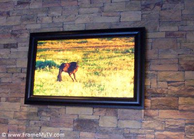 Tv frame on stone wall